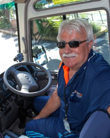 Easylink drive, Tony, in bus driver's seat.